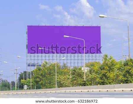 purple advertise billboards beside road