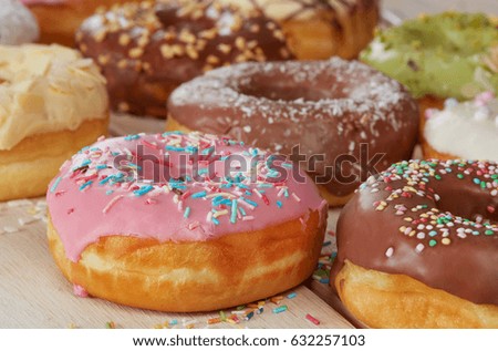 Delicious donuts on wood table