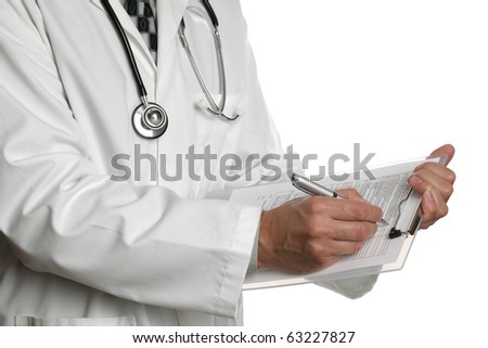 Male doctor filling out a medical document or patient examination notes