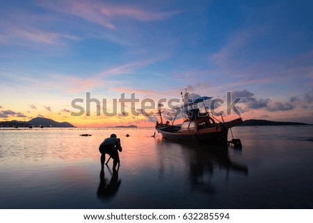 Long boat with beautiful sunrise seascape, beach in Phuket, Thailand.