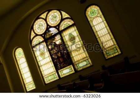 A stained glass church window taken from inside.