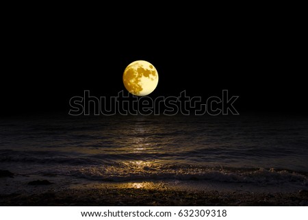 Panorama moon over the horizon on sea and moonlight. Landscape with the luna of night. Grand mystical fantastic view.