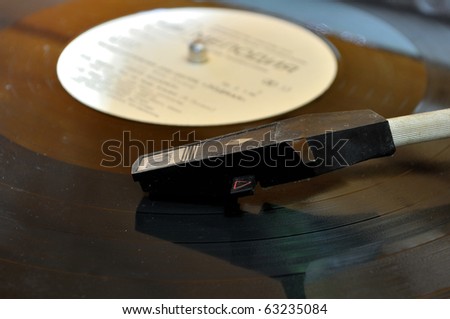 Close view of vinyl and player dusty head grunge photo shot