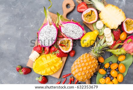 Exotic fruits on a gray background.  Royalty-Free Stock Photo #632353679
