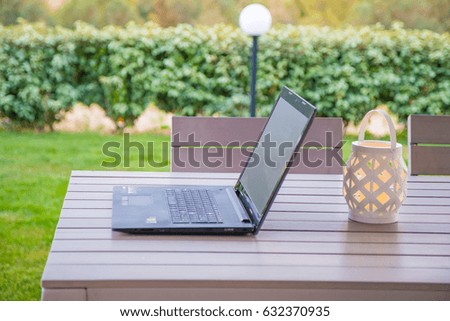 Laptop, tablet on wooden table, ready to work