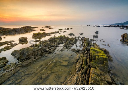 Long exposure image of stone / rock during sunrise in Mersing, Malaysia.