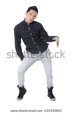 Young healthy fit asian male in animated dance moves isolated on white background