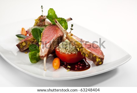Roasted Lamb Chops with Pistachio. Garnished with Vegetables and Basil Royalty-Free Stock Photo #63248404