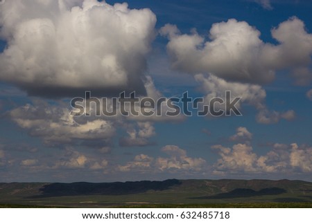 Steppe in spring, Kazakhstan. Amazing clouds and sky.