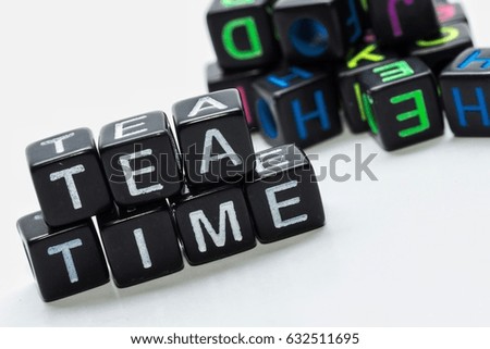 concept image of alphabet's cube and word - Tea time with isolated white background/selective focus