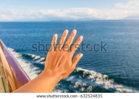 Woman showing new wedding ring hand on newlyweds honeymoon cruise travel taking selfie on holidays. Engagement ring and wedding band. Luxury vacations.
