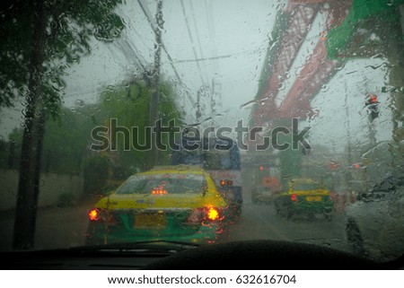Windshield wipers from inside of car, season rain.Heavy rain