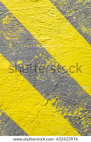 Background, yellow-gray warning stripes. Warning of danger