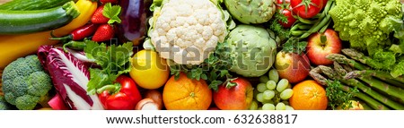 Panoramic wide organic food background concept with full frame pile of fresh vegetables and fruits mix forming bright colorful image Royalty-Free Stock Photo #632638817