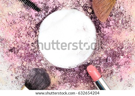 Closeup of makeup brushes, lipstick and mascara applicator on white background, with traces of powder and blush. Horizontal template for makeup artist's business card or flyer design, with copy space