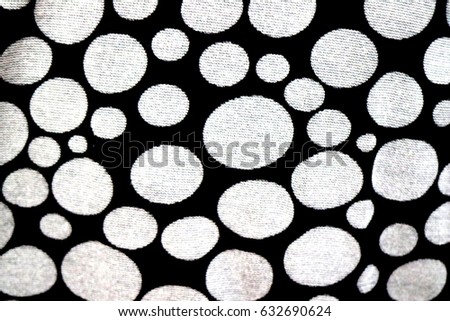 dark pattern with white polka dots on black background