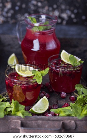 fresh cranberry juice in a glass with fresh mint and lime