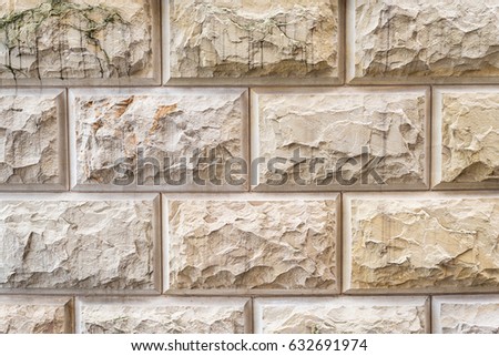 Stone background, sand wall pattern texture. Yellow natural stone facade, wall tiles.