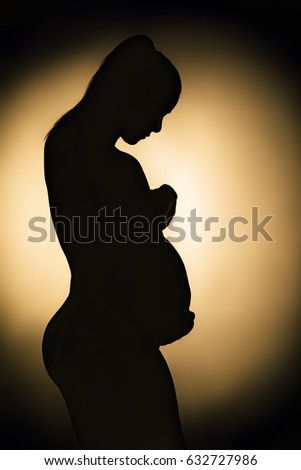 Silhouette of pregnant woman monochrome