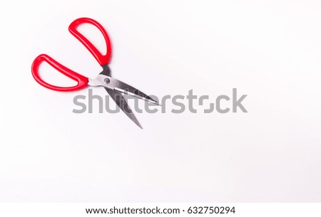 Open scissors on white background.