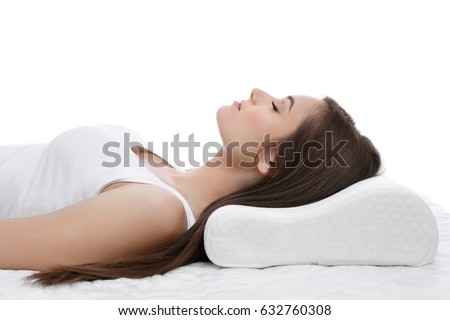 Young woman sleeping on bed with orthopedic pillow against white background. Healthy posture concept Royalty-Free Stock Photo #632760308
