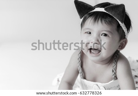 Crying Asian girl 6 months old, black and white picture