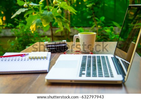 Home Office at home garden, green, fresh, relax with laptop and coffee cup