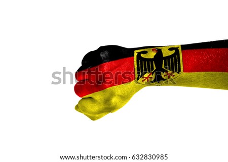 Fist painted in color Germany flag, hand isolated on white background.