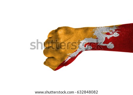 Fist painted in color Butane flag, hand isolated on white background.