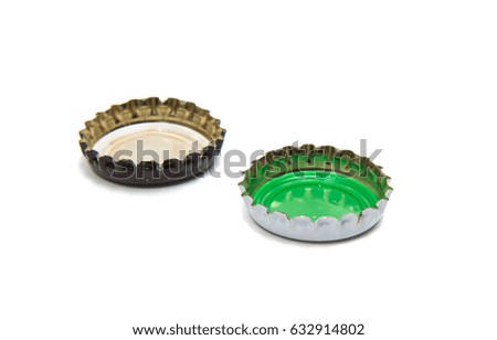 caps of beer on white background