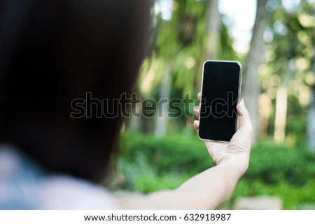 Woman selfie with smart phone in parks