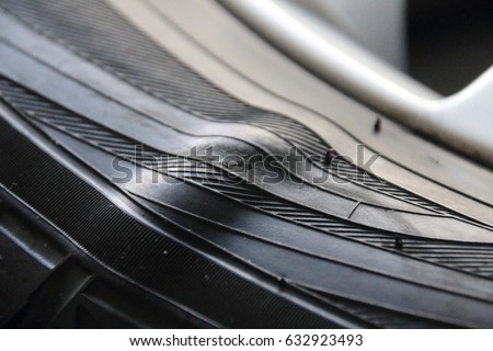 Sidewall bulge of a winter tyre Royalty-Free Stock Photo #632923493