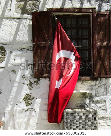 Turkish flag on the house glass
