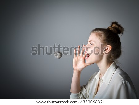 Woman in white is screaming at something. Word like a stone in motion - offensive word. A word spoken is past recalling Royalty-Free Stock Photo #633006632