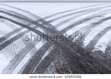  picture taken in winter after snowfall on a small rural road. Snow on the ground
