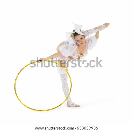 A gymnast standing twirling a hula hoop on white background. Studio photography of circus performers.