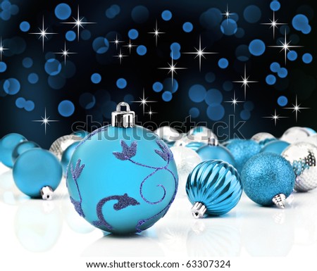 Blue christmas decorations against a star background