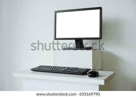 Mock up of computer screen on white table