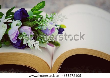 flower on book with copy space background, process vintage tone