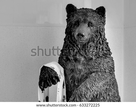 Bear statue on black and white image