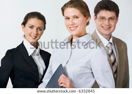 Customary business group of smiling professional over a white background