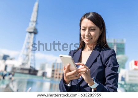 Business woman working on cellphone