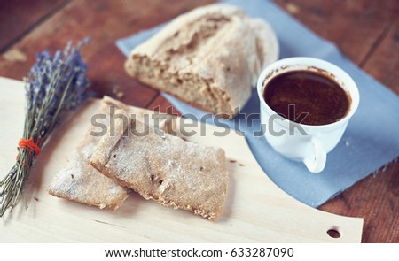 Breakfast with freshly brewed coffee and fresh homemade bread close up
