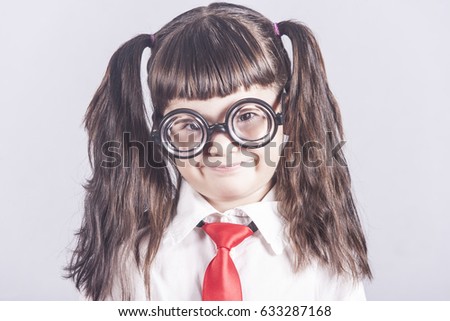 Funny portrait of a smart little girl