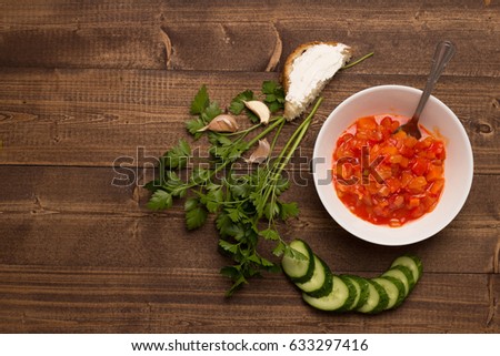 Sauce in a plate vegetables fried cucumber parsley