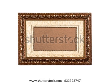 Vintage wooden frame with cardboard cardboard on a white wooden background