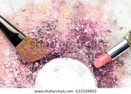 Makeup brush and lipstick on a white marble background, with traces of powder and blush forming a frame. A horizontal template for a makeup artist's business card or flyer design, with copy space