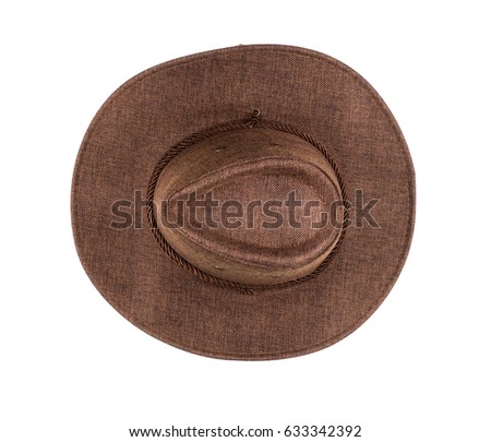 Brown cowboy hat on white isolated background, close-up, top view
