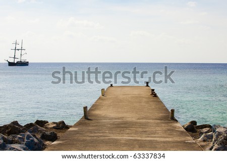 Dock and pirate ship on the ocean