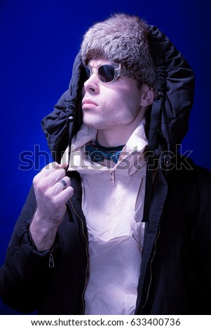 one young adult man, fashion photography, man, blue color background
